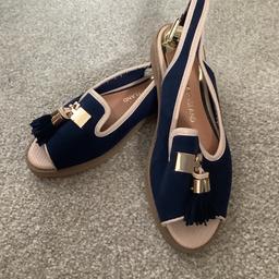 Flat sandals with tassels. Good condition.