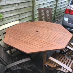 A very nice large garden table in great condition 5 ft wide 29.1/2 in high sturdy and strong with 4 folding armchairs 1 a recliner armchair all in good condition