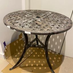 Sturdy, perfectly good, but very weathered (surface wise) garden table.
Needs a rub down and re-paint.
Diameter 70cm
Height 72cm

There are 2 matching chairs (sold separately) that are in much better condition 

Collection only