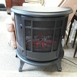 SALE - Was £70 NOW £55.

This Dunelm black curved fronted electric living coal effect stove fire is in excellent used condition and has three heat settings...

22 inches wide x 12 inches deep x 25 inches high.

Our second hand furniture mill shop is LOW COST MOVES, at St Paul's trading estate, Copley Mill, off Huddersfield Road, Stalybridge SK15 3DN...Delivery available for an extra charge.

There are some large metal gates next to St Paul's church... Go through them, bear immediate left and we are at the bottom of the slope, up from the red steps... 

If you are interested in this or any other item, please contact me on 07734 330574, or on the shop 0161 879 9365...Many thanks, Helen.

We are normally OPEN Monday to Friday from 10 am - 5 pm and Saturday 10 am -  3.30 pm.. CLOSED Sundays. CLOSED Bank Holiday long weekends...