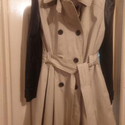 Miss Selfridge trench coat - size 16.
Stone/beige front with black faux leather arms. Black buttons.