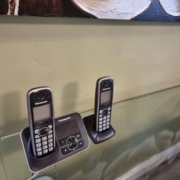 two black cordless answer phones, excellent condition.