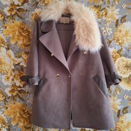 Only worn a few times. Beautiful grey colour with detachable fur. Size 12. Would also fit a size 14 as quite over sized.
