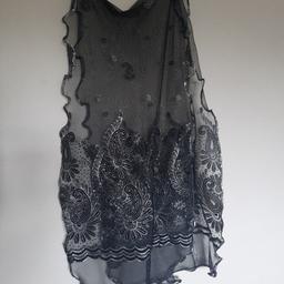 ladies gorgeous black chiffon scarf patterned and trimmed in high sparkle silver design. needs to be seen to be appreciated
