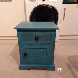 A lamp table / drawers in teal. Pull out drawer at the top and storage space behind the front door . H x 20 ins x W x 16 ins x D x 12 ins. Like new from a smoke-free home.