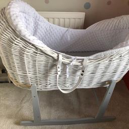 White wicker pod Moses basket on a grey rocking stand, complete with white insert. Can deliver if local