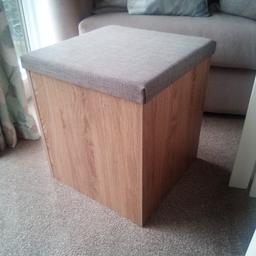square stool in light oak with grey cushioned top. 17" high and 15" X 15" top.