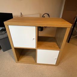 2x IKEA KALLAX Oak effect 2x2 units with 2 doors per item available. If you are interested in onyly one item then the price is 15 £.