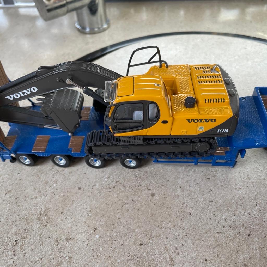 Corgi Cole’s and son lorry with a Tekno low loader trailer and Volvo digger trailer extends no mirrors on lorry never been played with been on display in cabinet no boxes cash on collection open to reasonable offers