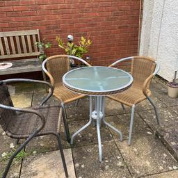 Bistro glass table top and 3 Ratten effect chairs ( normally you only have 2 chairs but have an extra chair in darker brown) . The diameter of table is 60cm and height 73cm. The chairs you can stack together. Both table and chairs have never been left outside, always put away in a shed. In very good condition.
Collection only
