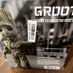 Groot guardian of the galaxy figure. New in box. Has three different face. Some tiny tree bits, think thats what they are. Can put him in differient positions. S63 area