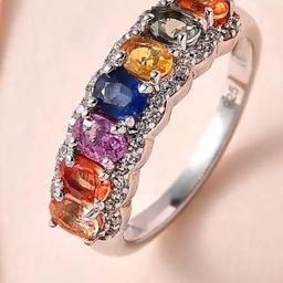 Set in sterling silver , and overlaid in platinum gold 
So will never tarnish, and will keep looking bright ‘
Over 2 carets of colours sapphires 
This is a beautiful ring !