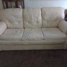 leather three piece suite. 3 seater settee. 2 chairs one worn more than other on edge of arm. general wear but still comfortable. cream colour