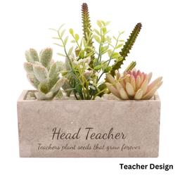 Succulent plant pot 

This rectangular stone planter boasts a natural grey finish, providing a stylish touch to any decor. Nestled inside are lifelike artificial succulents accented with white pebbles, adding a touch of freshness and beauty without any maintenance hassle. Comes boxed. Faux plant & stone. Size: H16.5 x W17 x D7cm. 
Teacher Design: Engrave up to 2 lines. Line 1: maximum 20 characters. Line 2: maximum 40 characters.

Brand new