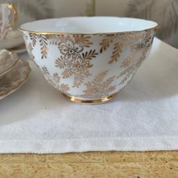 Pretty gold and white china
4 trios
1 sugar bowl 
1 milk jug 
1  cake plate
Some of the gold is wearing off which is to be expected due to it age 
Collection only
