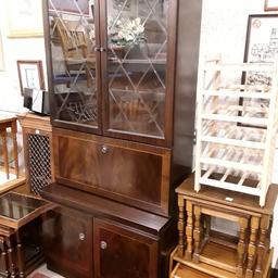 This lovely burr walnut / mahogany veneered drinks display cabinet with diamond fronted glass and wooden shelves separates into two sections... It is in good all-round condition. There are just some ring marks mainly on the floor of the cabinet and can be seen when the bottom doors are opened. The centre section pulls down to reveal the glass shelves drinks compartment.

36 inches wide x 18 inches deep x 77 inches high.

Our second hand furniture mill shop is LOW COST MOVES, at St Paul's trading estate, Copley Mill, off Huddersfield Road, Stalybridge SK15 3DN...Delivery available for an extra charge.

There are some large metal gates next to St Paul's church... Go through them, bear immediate left and we are at the bottom of the slope.

If you are interested in this or any other item, please contact me on 07734 330574, or on the shop 0161 879 9365...Many thanks, Helen.

We are OPEN Monday to Friday from 10 am - 5 pm and Saturday 10 am -  3.30 pm.. CLOSED Sundays. CLOSED Bank Holidays.