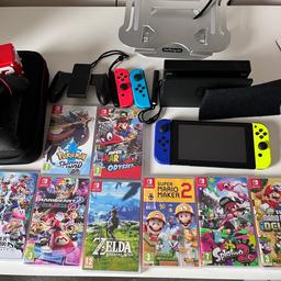 Nintendo Switch with Blue and Yellow joy-cons, spare set of joy-cons, spare wireless controller, 8 games (listed below), case, game card storage cube, dock, dock cover, original charger + hdmi cable and box

Console is in perfect working condition with very little signs of wear. 

Games Included:
Pokémon Sword 
Super Mario Odyssey
Mario kart 8 Deluxe
Super Smash Bros Ultimate 
Zelda Breath of the Wild
Super Mario Maker 2
Splatoon 2
Super Mario Bros Deluxe