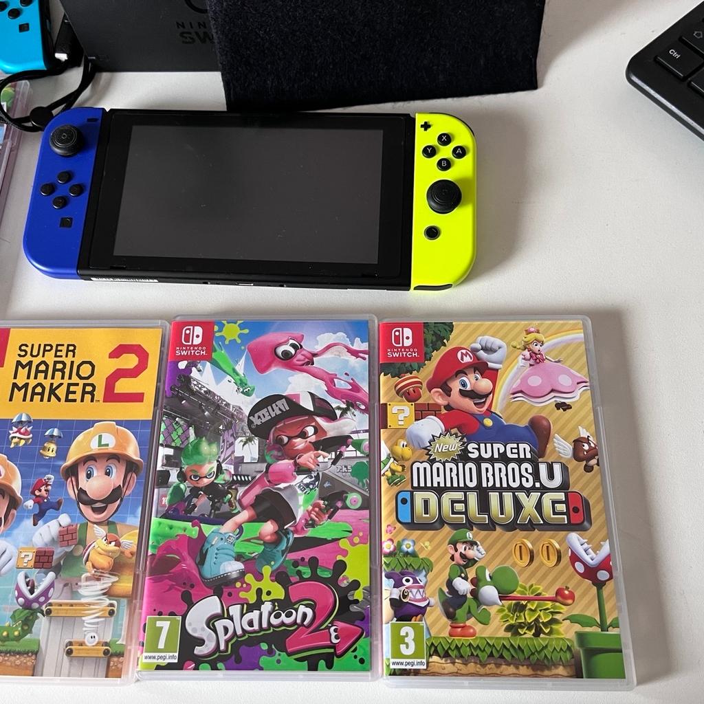 Nintendo Switch with Blue and Yellow joy-cons, spare set of joy-cons, spare wireless controller, 8 games (listed below), case, game card storage cube, dock, dock cover, original charger + hdmi cable and box

Console is in perfect working condition with very little signs of wear.

Games Included:
Pokémon Sword
Super Mario Odyssey
Mario kart 8 Deluxe
Super Smash Bros Ultimate
Zelda Breath of the Wild
Super Mario Maker 2
Splatoon 2
Super Mario Bros Deluxe