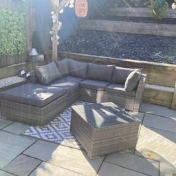 Grey rattan corner sofa, with coffee table, insert for ice bucket for beer/wine ect. Bought from inspirations in brombrough, cost over £800 new. Cushions all been cleaned. Excellent condition. Bigger table forces sale.