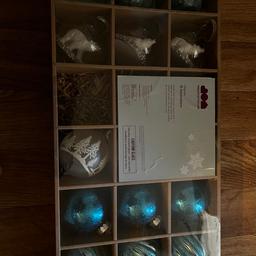 I have two beautiful boxes of 15 baubles and 3 stars. Same in each one. Some glass and some plastic or something similar S63 area. Will sell separately or together.