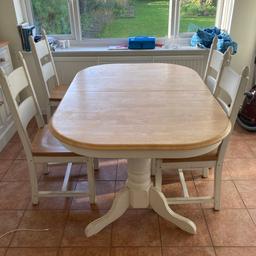 Solid country style dining table with lacquered top and features in cream. Seats 4 and can extend to seat 8. Four chairs included. The extension mechanism is easy and quick. In good condition. 

Can do local deliveries dependent on postcode. 

Price negotiable - it is already heavily discounted from original cost.