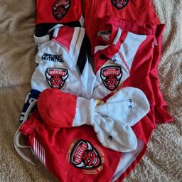 8 year old salford red devils bundle 2023 home and away tops 2023 home shorts and socks a tracksuit top and a wind breaker jacket
