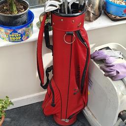 Golf clubs as shown with some golf balls.
Good for a knock around the park with the kids, comes with bag.