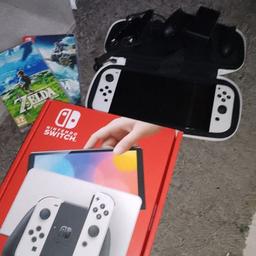Nintendo Switch White OLED.
ZELDA BREATH OF THE WILD,
ZELDA TEARS OF THE KINGDOM.
Console case and controllers charging dock and connection wiring.
low energy consumption entertainment