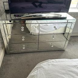 Stunning Large mirrored chest of drawers very heavy and sturdy with 6 drawers there are 2 cracks in this piece of furniture which are in pictures but the glass can be replaced hence the price viewing welcome from a pet and smoke free home 

Measurements 
Width 57 inches 
Depth 22 inches 
Height 33 inches
