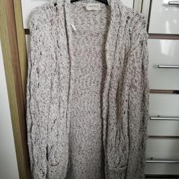 Size 12 summer cardigan with side pockets.