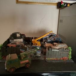 diorama of scrap yard with corgi dinky and matchbox toys. tow truck and unit moves and the crane. but others are glued down . can post at cost or collection from sedgley Dudley. . some parts my come loose in transit 