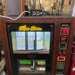 Sound leisure superstar cd jukebox in good condition refurbished laser fitted album select or single tracks set on free play comes with wall bracket twin volume control and key and a free speaker to get you going any questions please ask