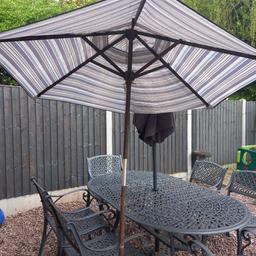 large wooden umbrella,  blue stripes is marked and faded, is old but has been shed kept so has plenty life left , buyer to collect