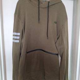 Adidas hoodie in green has front zip pocket
size XL
good condition no marks