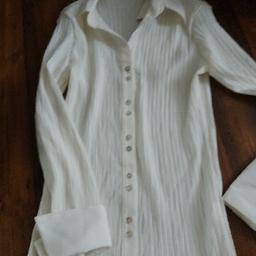 Lovely quality blouse,turn up cuff.Stretch effect from creasing design.