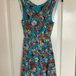 Topshop playsuit.
Bright and colourful, perfect for holidays.
Zip up back.
Cross over at front so slight opening to show stomach.
Worn 2-3 times max so excellent condition.
Smoke free, pet free home.
Collection Wombwell s73 - £6.
Will post in uk for £10 total - payment needed via PayPal for this option.
