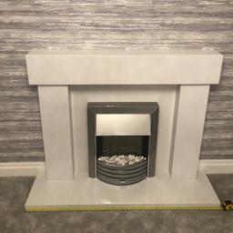 White marble fireplace with electric fire