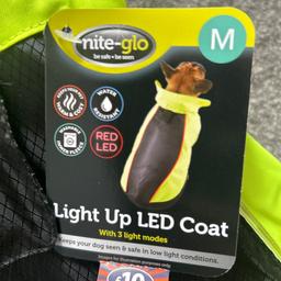 Lovely quality, water resistant, LED dog coat. Inner liner is washable. Can be used with or without liner. Too big for my dog. Size on pics. Have larger coat listed too. No offers please. New with tags.