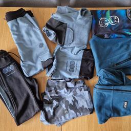 Here for sale is a bundle of boys clothes aged 10-11 years.

1). Teal hooded jacket and joggers tracksuit teamed with a teal and multi colour t shirt.  The joggers have 2 scuffs/almost holes to the knees as shown on pics, I have taken a pic with my finger under one of the holes to show they do not go through and show skin hence me labelling them as scuffs and happy to sell

2). 4 piece black and blue tracksuit set consisting of 2 pairs of joggers, a t shirt and a jumper

3). Blue camo t shirt