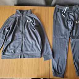 Here for sale is a great condition grey under armour tracksuit in their size M which works to aged 10-12 years on their size chart

Collection only Norton Canes