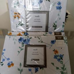 New Dunelm king size bedding set with 2 pairs of extra pillow covers. White/blue floral colour.Beautiful set.Can post for extra cost.
