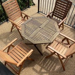 Good quality outdoor table and chair set made from hardwood, in good condition, but would benefit from a coat of stain.
The chairs recline, and fold flat, but the table is fixed, so would need a van to remove
We have a large wind out umbrella as in the photos and 3 seat cushion/ backs which the buyer can have if wanted, the umbrella has faded in the sun but still works perfectly

Collection from Cleveleys only