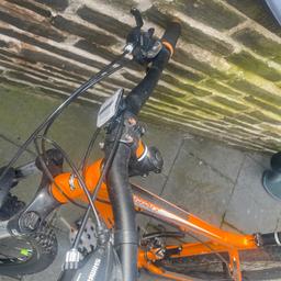 Bike carrera - 
Color - orange 
Brakes: Mechanical disc-brakes for smooth, controlled stopping 
Forks: Zoom 595s-AMS forks with 100mm of travel and lockout 
Enhanced GEL saddle (Seat) 
Tyre size 27.5 inch 
Good condition 
RRP from Halfords £360
Selling £150
Collection from Savile park Halifax HX1