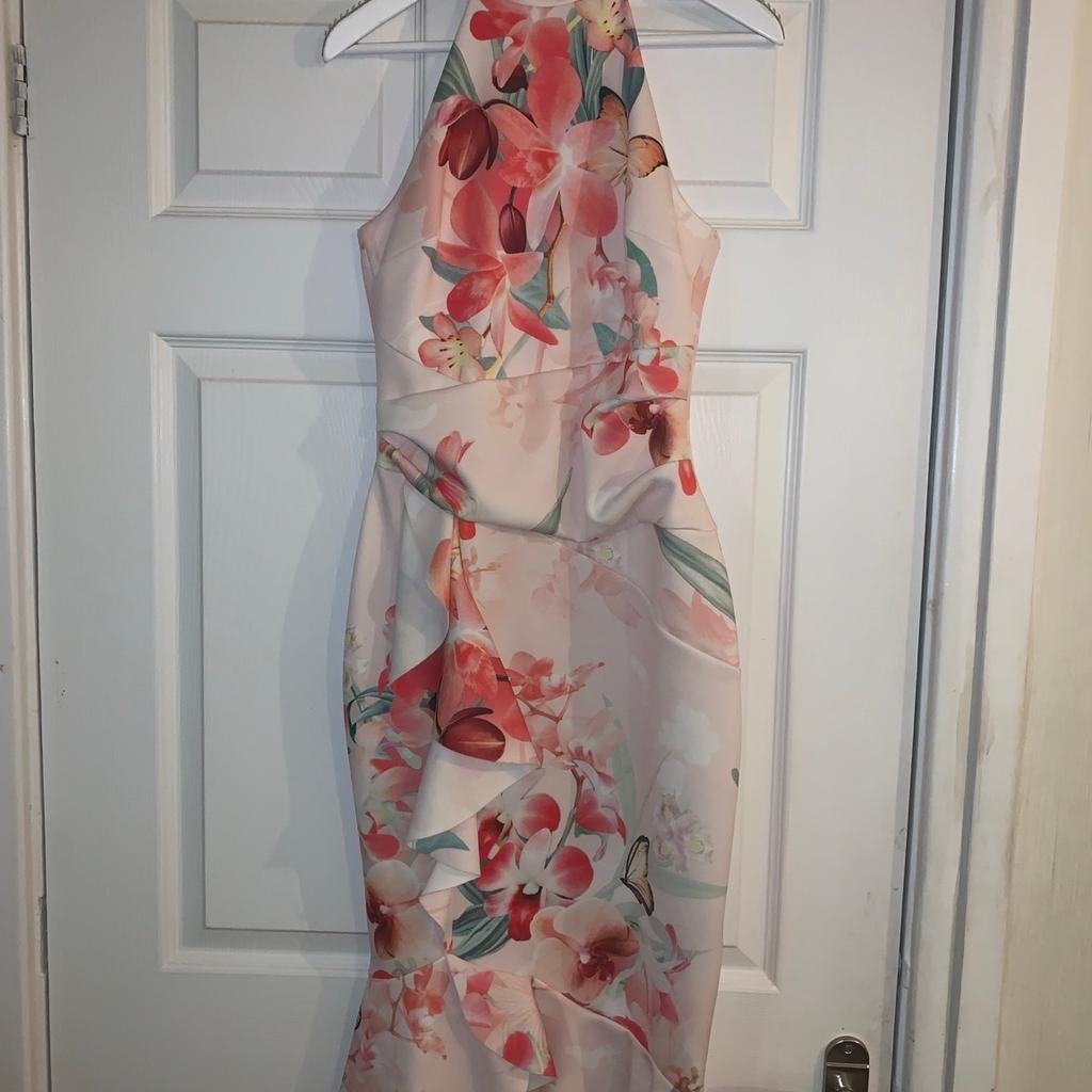 White halterneck midi figure hugging occassion frill dress with floral detail. Only worn once to wedding.