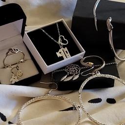 sterling silver bundle all new or like new their is rings a dream catcher bracelet a dolphin bangle a mum and heart necklace a large pair of cz hoop earrings all fully hallmarked postage to be covered if needed plz thanks