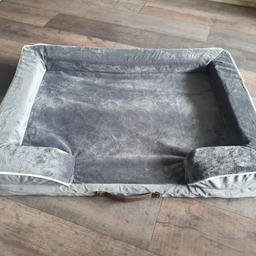 Brand new large dog bed.
Soft cushioned mattress with sponge support edging.
Grey velvet effect material which unzips to be washable.
Carry handle at front.
Lovely bed, just too small for our dog.
Width 89cm.
Depth 64cm