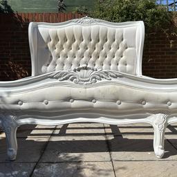 This stunning & elegant White Leaf French King size Bed-frame is in a great used condition. Fabric has some stains, marks, etc and is in a need of a good clean or re-covering, and the rest has some minor dents, scratches and scuffs. Had a minor repair and touch ups. Still a magnificent bed. Please see photos.

This finest French style bed! A stunning bedstead constructed magnificently with a high wing back style headboard sumptuously upholstered in glamorous white buttoned back fabric and deep style buttons.

W: 170cm

L: 220cm

Headboard height: 127cm

Footboard height: 59cm

Please see my other items

Collection from Sunbury,