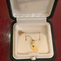 Hallmarked 750/ 19 Ct gold chain with hallmarked 18 Ct gold khamsa 🪬 pendant topped with topaz bleu stone . In good condition 40 cm length comes in box . Pls look at the pictures attached for more details can accept PayPal,collection,bank transfer or delivery of close by . Shpocks wallet too