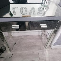 Mirrored side table or dressing table. Front glass panel cracked as in picture and covered with silver tape. Can be used as is or replaced. Can deliver local for fuel.