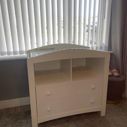 Baby changing station in excellent condition, has two large draws and two storage spaces for baskets, again more storage.